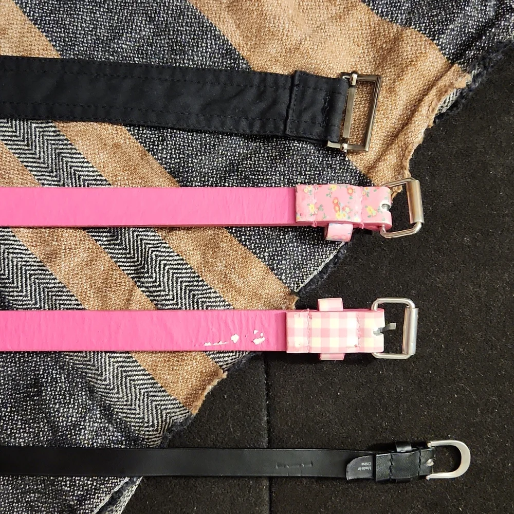 4 used belts printed pink and solid black